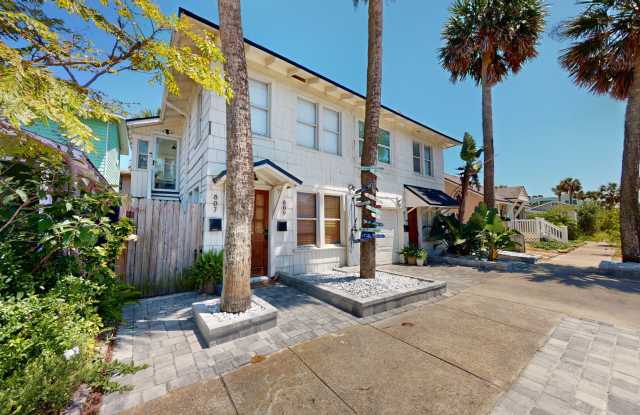 Presenting a meticulously renovated and fully furnished beachside bungalow, ideally situated just a block away from the sparkling shores! photos photos