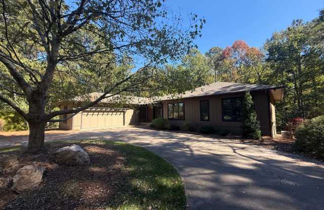 **OFFERING REFUNDABLE APPLICATION FEES & $200 MOVE IN PROMOTION** Tranquil and Secluded Raleigh Home with Unique Bonus Features Located on a Large Lot on a Private Street with Plenty of Privacy and Outdoor Space Gallery 1