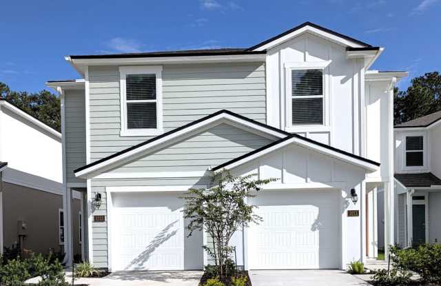 NOW LEASING - NEW 2026 VILLA CONSTRUCTION!! 3/2.5/1 with premium finishes in the a new development community of in Hansen Creek - conveniently located just off I-295 and Lem Turner. Gallery 1