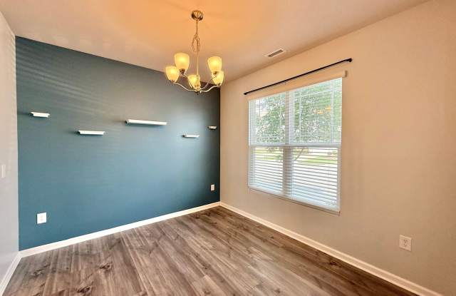 **OFFERING REFUNDABLE APPLICATION FEES & $100 MOVE IN PROMOTION** Modern 3BD, 2.5BA Clayton Townhome Near Highways with Easy Access to Downtown Clayton and Garner Gallery 4