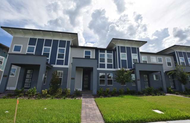Brand New Energy-Efficient Town Home 3 Bedrooms and 2.5 Baths, with 2 Car Garage and Cover Patio, with large walk-in closets in every room ready now at 7067 Carrickbend Lane, Orlando, FL 32819 at Sandlake Sounds photos photos