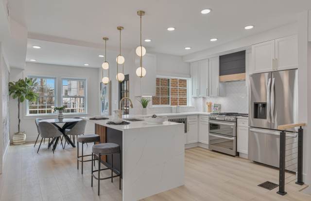 Tudor Duplex w/ 3 Parking Spaces + EV Charging and Garage Gallery 3