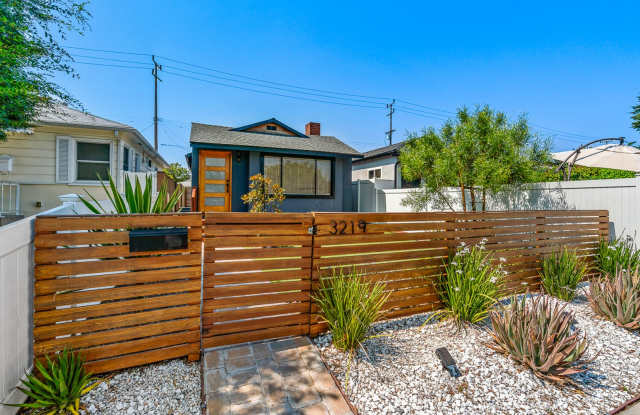 Move-in ready Magnolia Park gem — modern finishes, private front deck,  converted garage studio! photos photos