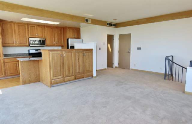 2 Story Condo with Parking, Views and Outdoor Space! Gallery 1