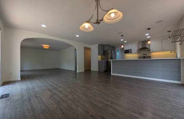 Updated 3-Bedroom, 2.5-Bath Home ~ Solid Surface Flooring and Spacious Kitchen! Gallery 1