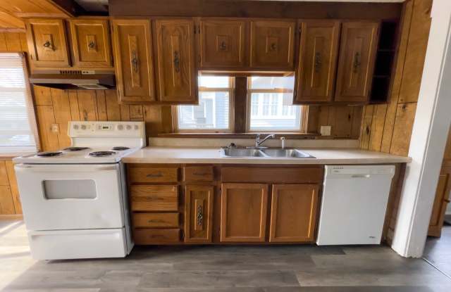 PRELEASING for AUGUST! Convenient Campus Living | 4BR with Fenced Yard & Covered Parking photos photos