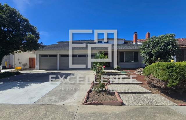 Newly Updated 5/3.5 House with 3 Car Garage, Full Bedroom and Bath Downstairs, Wet Bar, New Floors and More! Gallery 1