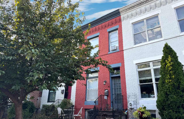 Stunning 2 BR + Den/2.5 BA Two-Level Home with Electric Garage Door Parking in Capitol Riverfront! photos photos