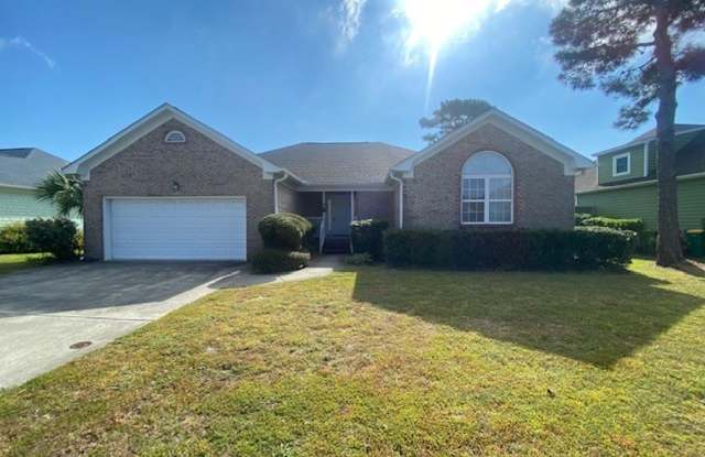 Introducing a charming 3-bedroom, 2-bathroom house located in the desirable area of Kure Beach, NC. photos photos