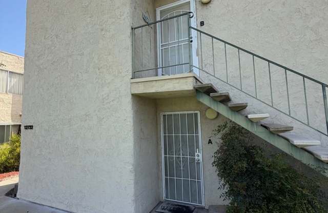 2BR/1BA Lakeside ground floor condo with 1 car detached garage, 1 uncovered parking space & community pool. Gallery 1
