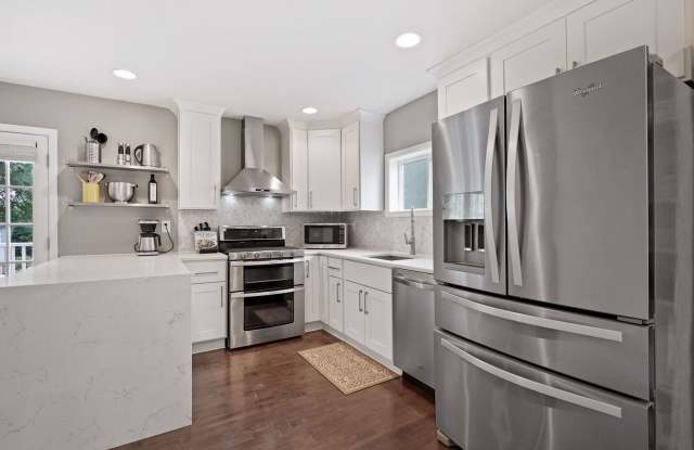 Renovated Cape Cod with Den, Garage, Driveway & Spacious Backyard Gallery 1