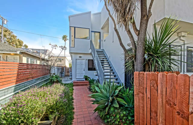 MODERN & BRIGHT. TOP-FLOOR, 4BR3BA HOUSE-LIKE APARTMENT W/ OPEN FLOOR PLAN, 3 DECKS FOR INDOOR/OUTDOOR LIVING & 2-CAR GARAGE JUST BLOCKS TO ABBOT KINNEY, PARK & MINS TO CANALS & BEACH! photos photos