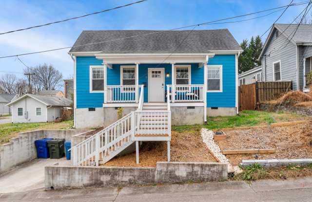 Cheery downtown bungalow with stunning finishes and fenced back yard. photos photos