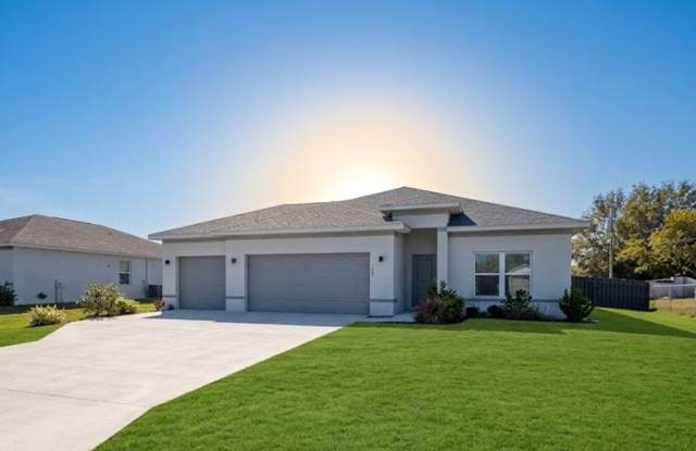 Nearly-New Cape Coral Home with 3-Car Garage, Fenced Yard & City Water | Luxury Living at Its Best! photos photos