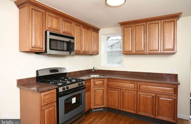106 S ARLINGTON AVENUE - 106 South Arlington Avenue, Baltimore, MD 21223