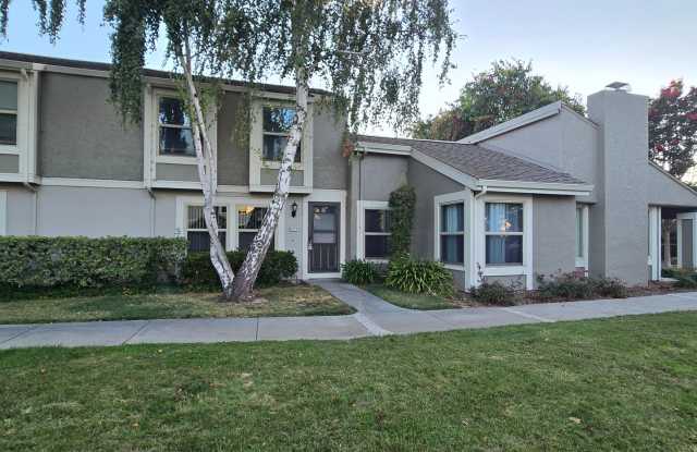 Spacious 2-Story Townhome, A/C, Pool, Renovated Inside, Wood Flooring, Beautiful Complex, Private Patio! Gallery 1