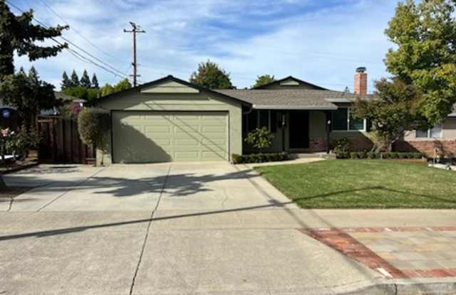 Beautiful updated home with all stainless steel appliances, hardwood floors throughout, and a large, landscaped backyard photos photos