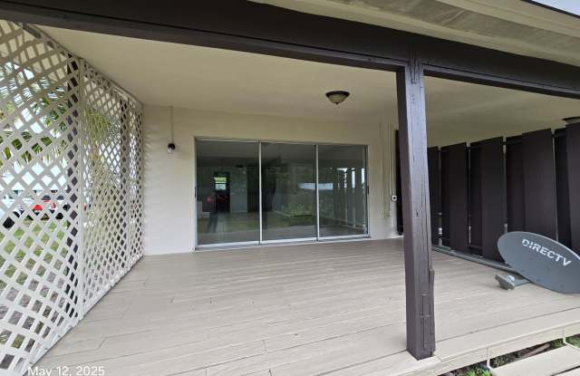 This renovated home provides modern convenience with a durable metal roof, impact-resistant windows, and brand-new carpeting throughout. Gallery 3