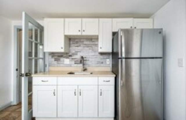 Renovated 4BR with In-Unit Laundry Near Moody Street Gallery 1