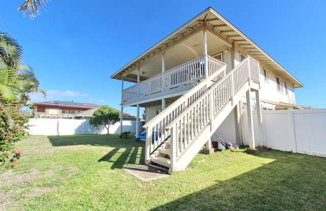 Malimali Street home with garage, fenced yard, central A/C, stainless steel kitchen appliances  sink, large upper lanai, nice flooring, ceiling fans with lights, large kitchen with island, partially furnished photos photos