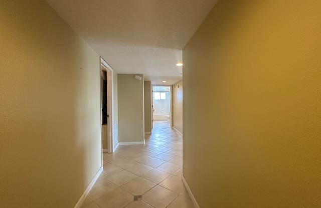 Spacious 5th-Floor Condo | Fully Furnished & Move-In Ready| indooor parking garage space Gallery 3
