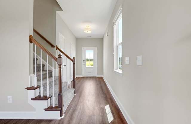 Beautiful home with a charming wrap-around front porch and open floor plan! Gallery 3