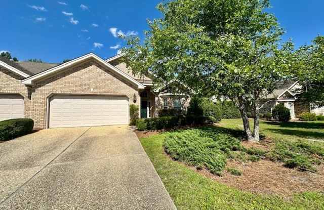 Introducing a stunning townhouse in the desirable community of Brunswick Forest in Leland, NC. photos photos