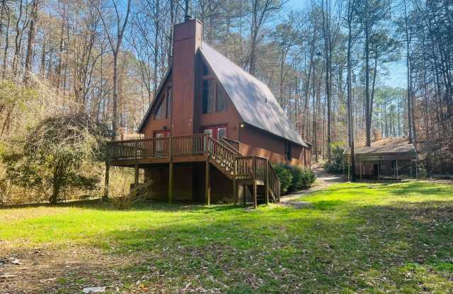 Charming lake cabin featuring 3 bedrooms and 2 bathrooms with large open primary suite AND lake access! Must see! photos photos