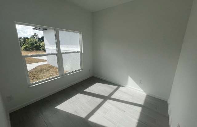 New 4 Bed / 2 Bath / 2 Car Garage Family Retreat in Desirable Lehigh Acres! Gallery 4