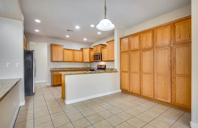Spacious 4-Bedroom Home with Open Living Areas in Stallion Mountain Golf Club Community Gallery 3