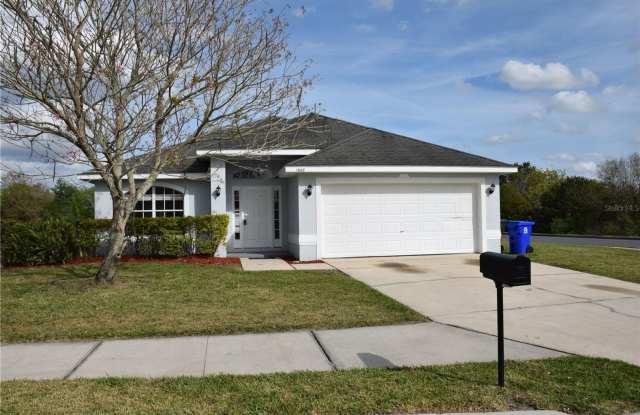 Must See! Stunning Lake Front Views! Beautiful Corner Lot Home – 4 Bedrooms, 2 Baths! - 1668 Turtle Rock Drive, Lakeland, FL 33803