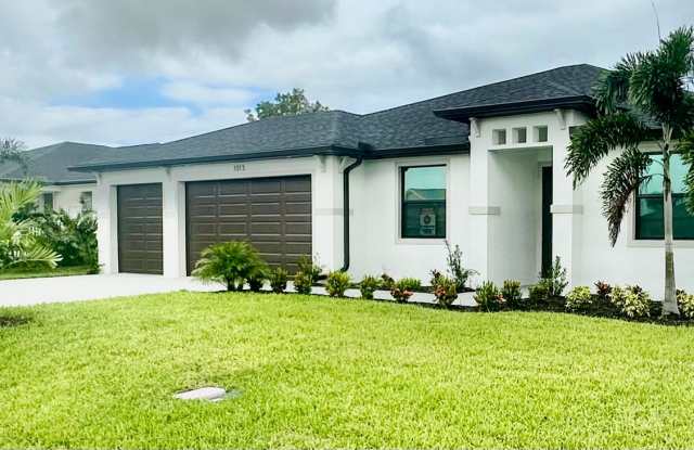** $500 Special ** Brand New Construction Home in NE Cape Coral with a Pool on a Corner Lot - 1013 Northeast 10th Street, Cape Coral, FL 33909