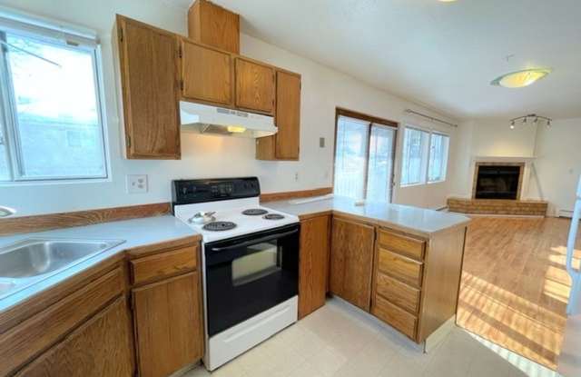 RARE FIND! Spacious and bright three bedroom apartment in South Anchorage with in unit laundry, fireplace, and balcony! photos photos