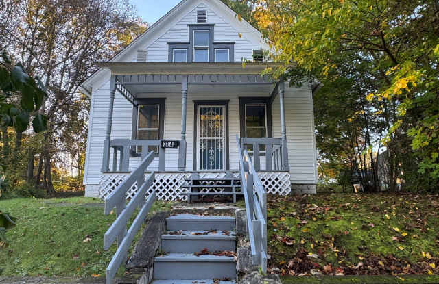 Charming 3-Bedroom Akron Home with Full Basement, Covered Porch & Flexible Living Space! Gallery 1