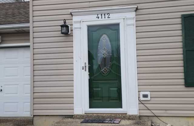 Fantastic 3 Bedrooms & 1.5 Bathroom, Two Story with a Garage!  Freshened Paint throughout!  Newer Pergo Flooring throughout! Nice Backyard and a Fireplace! Gallery 4