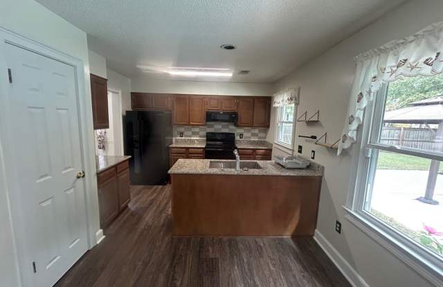 Your own backyard oasis awaits! Enjoy spacious living, a private pool, and worry-free pool upkeep at 403 Finwood! Gallery 4