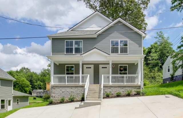 Two Story Duplex With Hardwood Flooring and White Cabinetry - 929 Woody Hills Drive, Clarksville, TN 37040