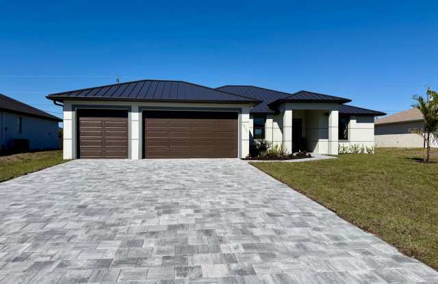 Luxury New Canal Home with Heated Pool  Spa – 3-Car Garage in Prime NE Cape Coral! photos photos