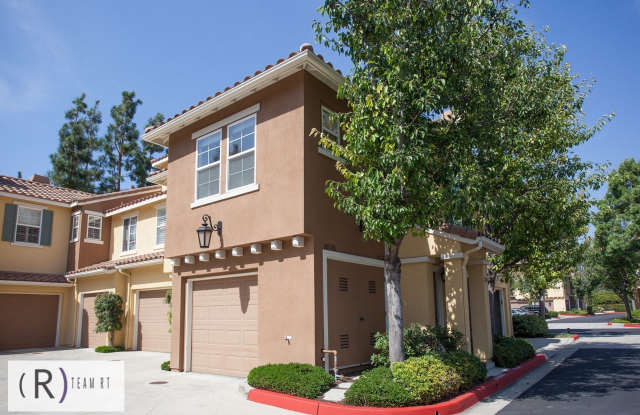Discover Serene Living in Northwood Pointe Community - Gated 2 Bed, 1 Bath with Attached 1-Car Garage - 2000 Timberwood, Irvine, CA 92620