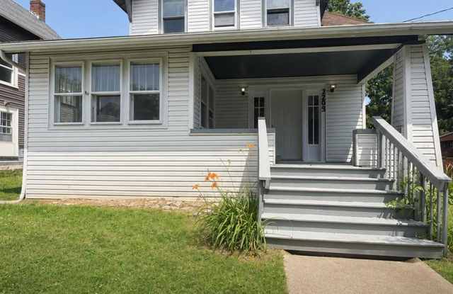 Spacious Akron Single-Family Home with Front Porch, Dining Room, Fireplace & Backyard! photos photos
