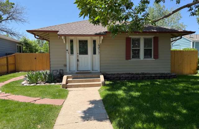 Evolve Real Estate: Charming Ranch Home with Large Yard and Finished Basement in Englewood! Available August 1. - 4077 South Pearl Street, Englewood, CO 80113