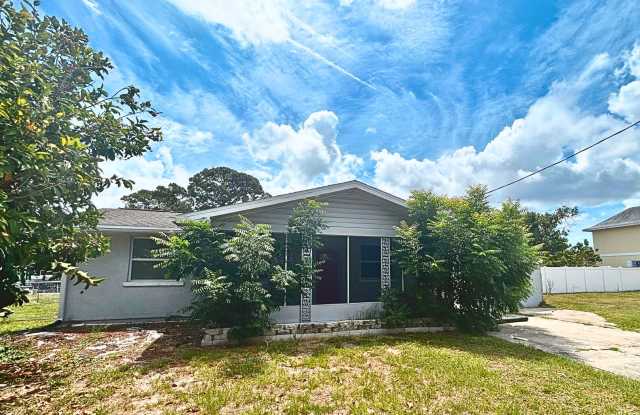 NEWLY RENOVATED CANAL-FRONT HOME ON DOUBLE LOT WITH BOAT LIFTS & MANGO TREES! Gallery 1
