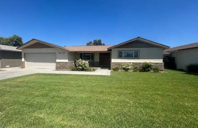 Stay cool in Lemoore in this spacious home with a pool! photos photos