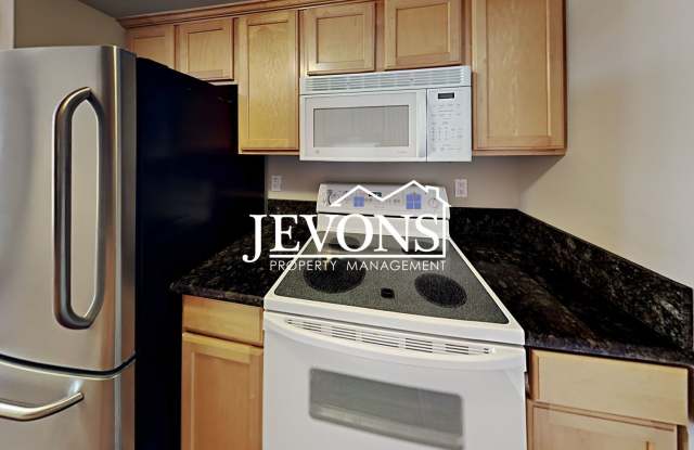 Coming soon! Charming top-floor condo with fully equipped kitchen - Water, sewer, and garbage included! photos photos