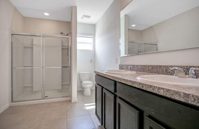 DISCOUNT OFFER! Spacious 3-Bdrm Townhome with 2-Car Garage in Gated Community Gallery 1
