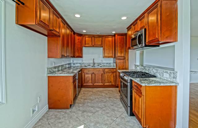 Spacious Three Bedroom Three Bathroom Two-Story Apartment With Private Pool Access And Balcony With Pool View. Gallery 1