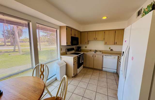 FULLY FURNISHED 2-Story Townhouse on Canal – Pool, Golf Views & ALL Utilities Included! Gallery 4