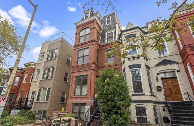Stunning 3-bedroom, 2.5-bath two-level penthouse with den in historic Shaw, featuring soaring ceilings, a gourmet kitchen, luxurious primary suite, private rooftop deck with city views, gated parking, and easy Metro access. Gallery 1