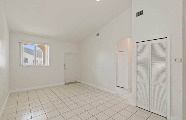 2-bath condo on the 2nd floor with a newly renovated kitchen featuring modern cabinets and granite countertops. Gallery 4