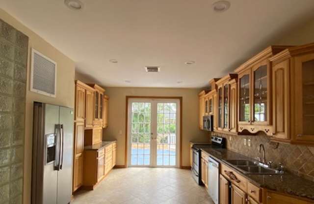Beautifully renovated and restored 1925 Mediterranean Spanish-style single-family home featuring 2 bedrooms, 1 bathroom, plus a separate office with French doors. Gallery 3